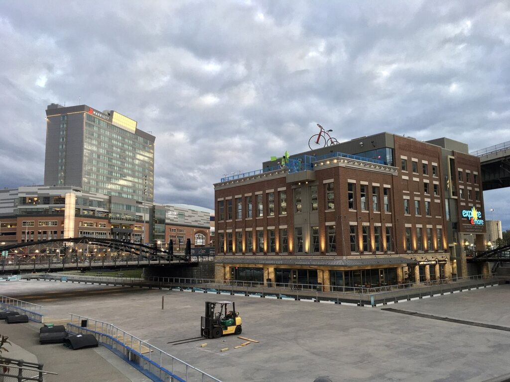 The brick Explore and More Children's Museum building at Canalside in Buffalo, with the HarborCenter tower behind