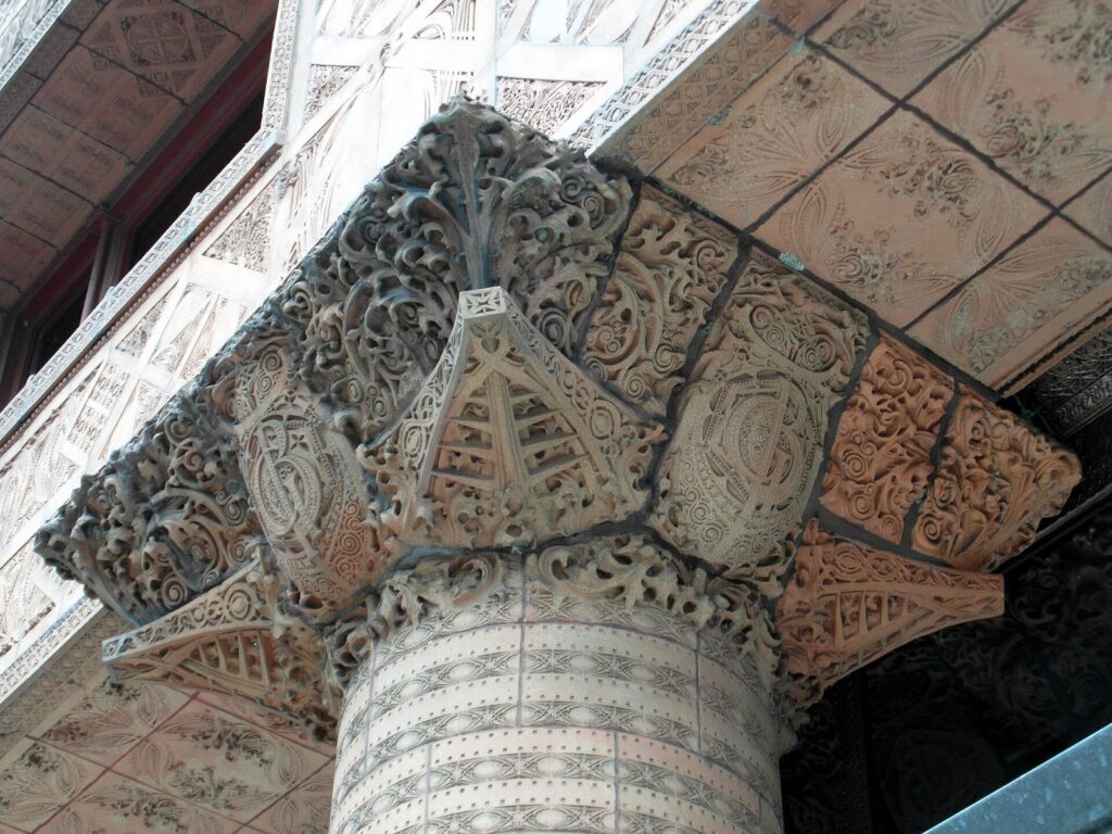 Close-up of the red terra-cotta ornament on a pier capital at the base of the Guaranty Building in Buffalo