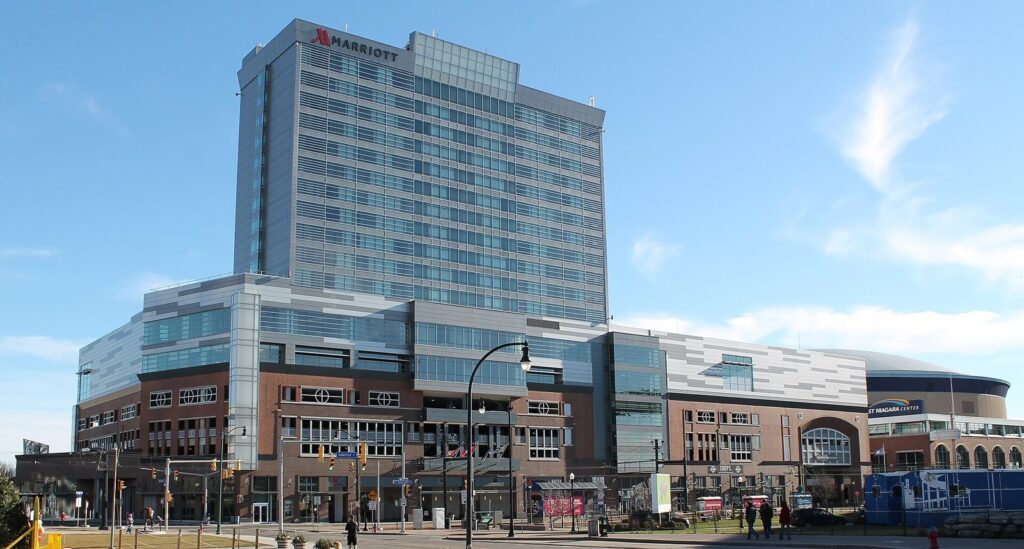 The Buffalo Marriott tower at HarborCenter rising above Canalside, with the KeyBank Center at right