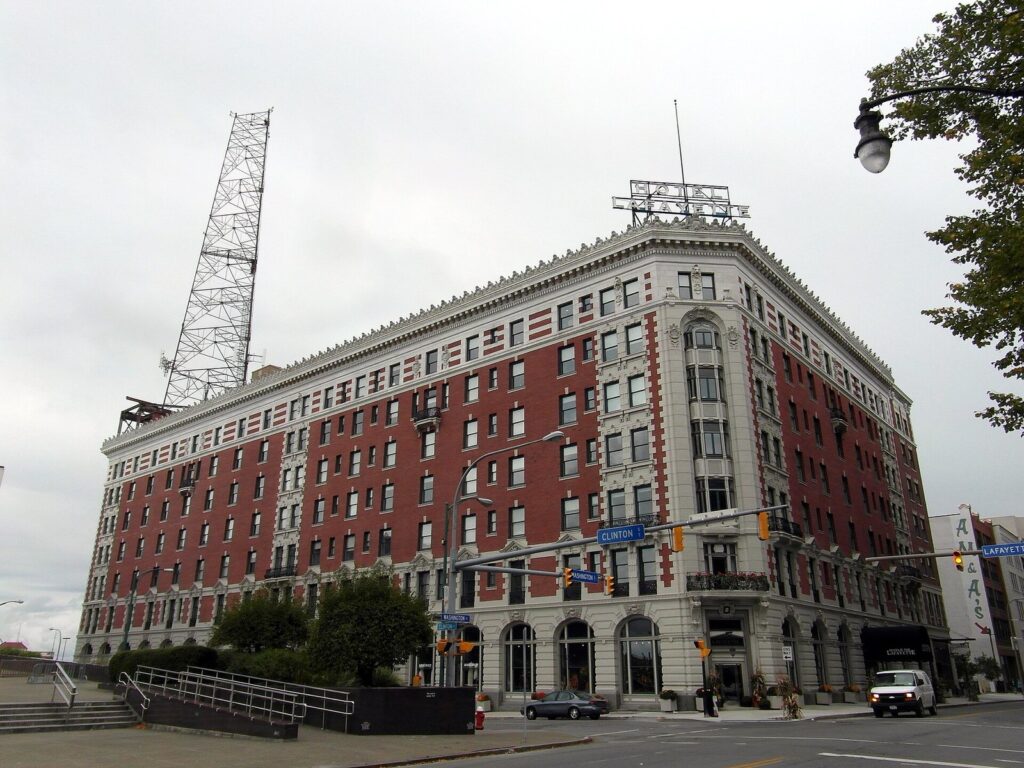The red-brick and white-trimmed Hotel at the Lafayette on Lafayette Square in downtown Buffalo, a historic option when deciding where to stay in Buffalo NY