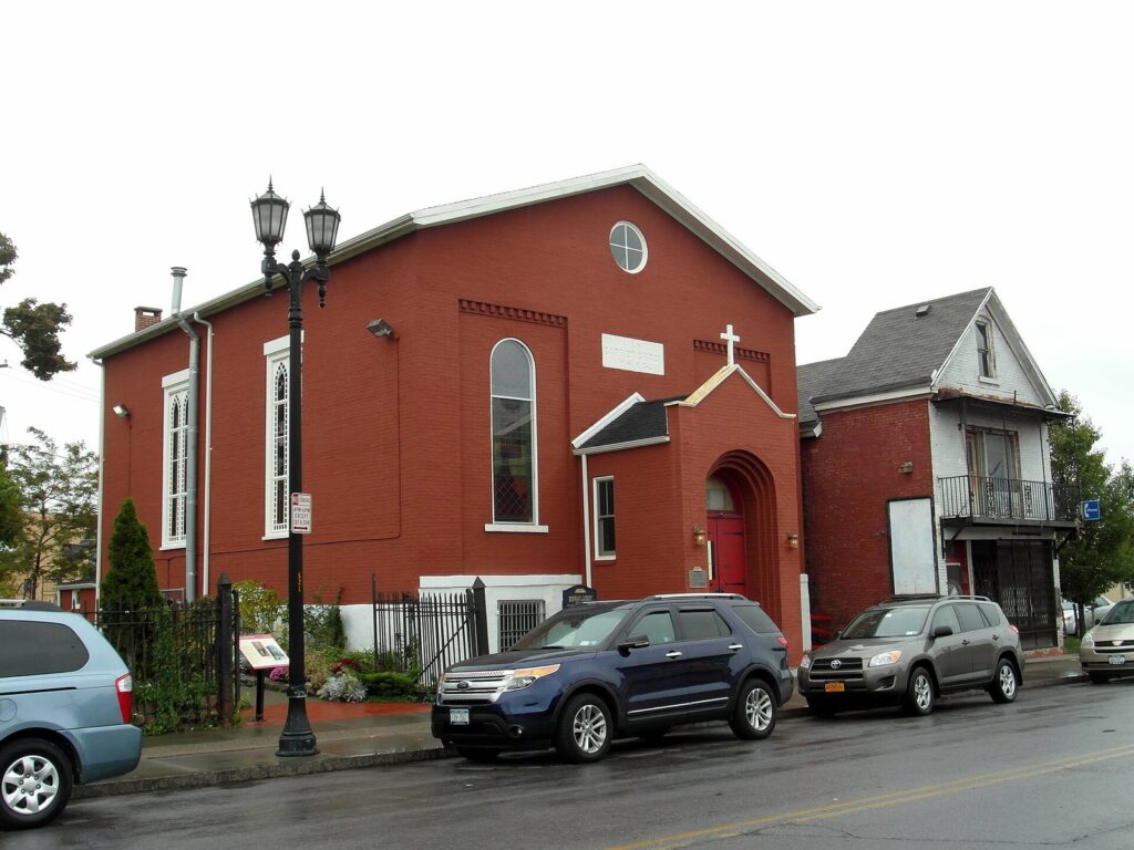 The red-brick Michigan Street Baptist Church in Buffalo, a former Underground Railroad station, with a historical marker out front