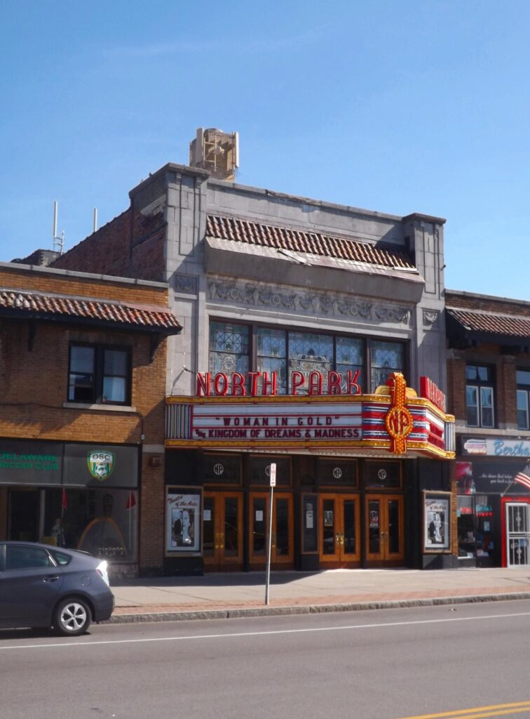 The North Park Theatre on Hertel Avenue in Buffalo, with its lit marquee and 1920s facade