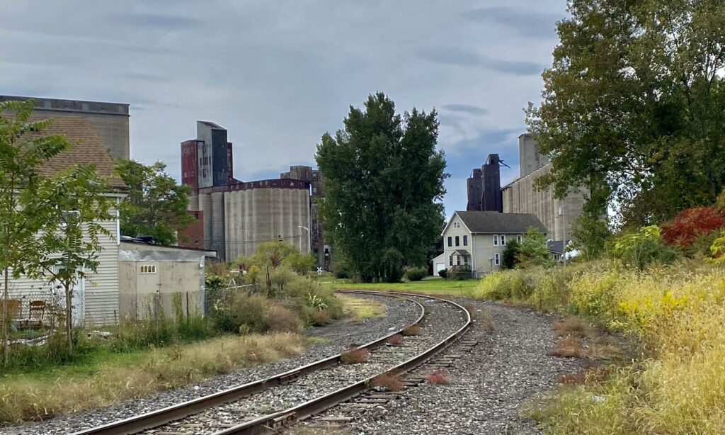Wooden houses, a curving rail line and concrete grain elevators in Buffalo's Old First Ward, a stop in this Buffalo NY neighborhoods guide