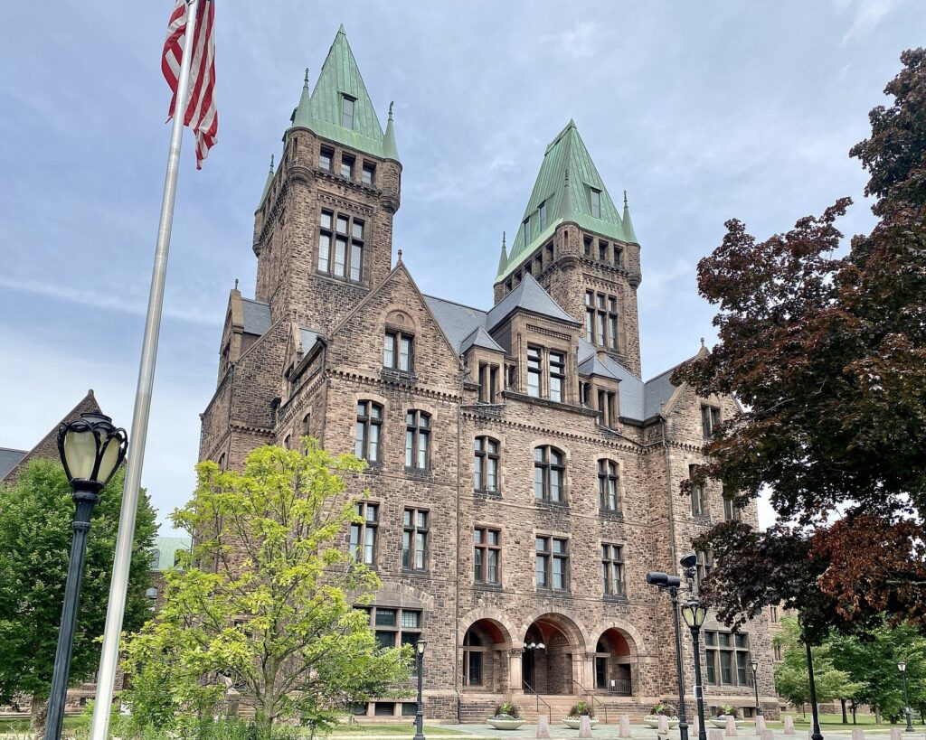 The twin copper-roofed towers of the central building at the Richardson Olmsted Campus in Buffalo