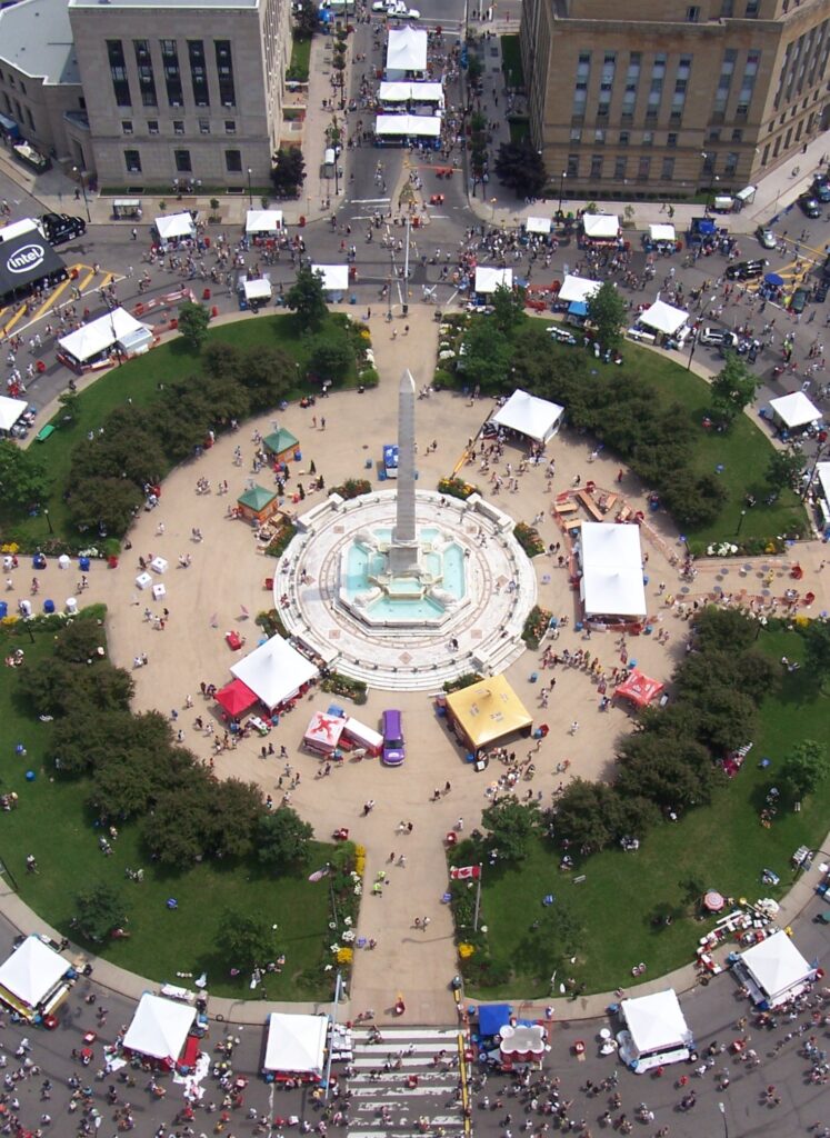 Aerial view of white food tents and crowds around the McKinley Monument in Niagara Square during the Taste of Buffalo