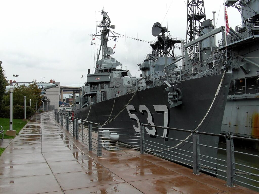 The gray destroyer USS The Sullivans moored at the Buffalo and Erie County Naval and Military Park
